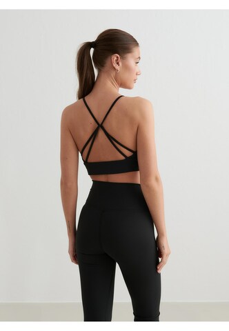 Bustino Reggiseno sportivo di Aim'n in nero