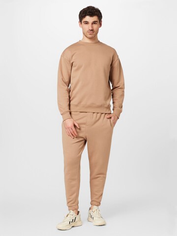 BURTON MENSWEAR LONDON Tapered Pants in Beige