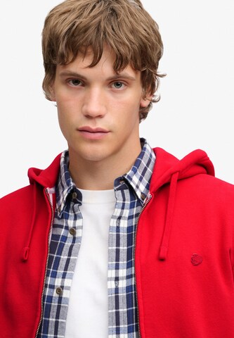 Veste de survêtement 'ESSENTIAL' Superdry & Co en rouge