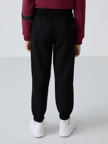 Tommy Life Broek 'TOMMY Kinder Jogginghose' in Zwart