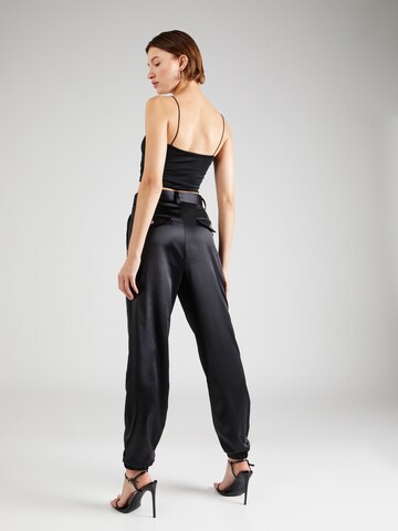 Guido Maria Kretschmer Women Tapered Pleat-front trousers 'Nina' in Black: back