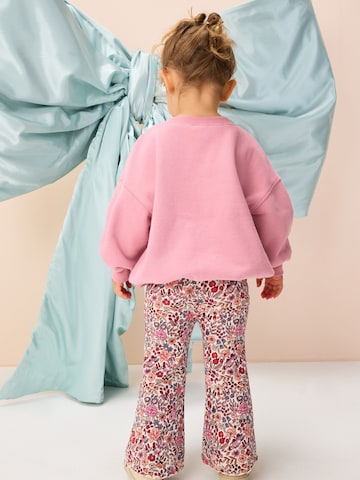 Set Next en rose