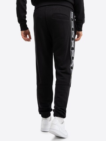 LONSDALE Конический (Tapered) Спортивные штаны 'Grutness' в Черный