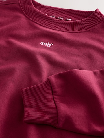 Sweat-shirt self. en rouge