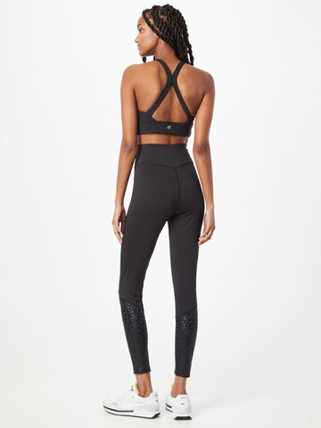 ABOUT YOU - Skinny Leggings 'Thalisa' en negro