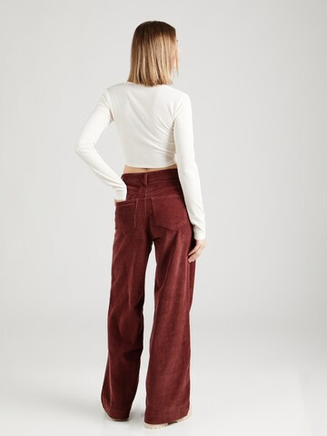 florence by mills exclusive for ABOUT YOU Zvonové kalhoty Kalhoty 'Poinsettia' – hnědá