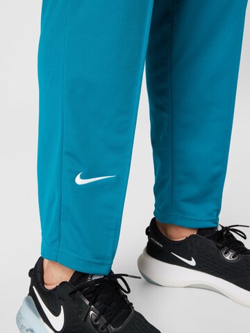 NIKE Tapered Sporthose in Blau