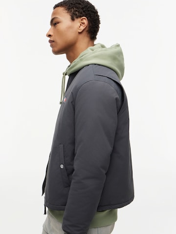 Tommy Jeans Átmeneti dzseki - szürke