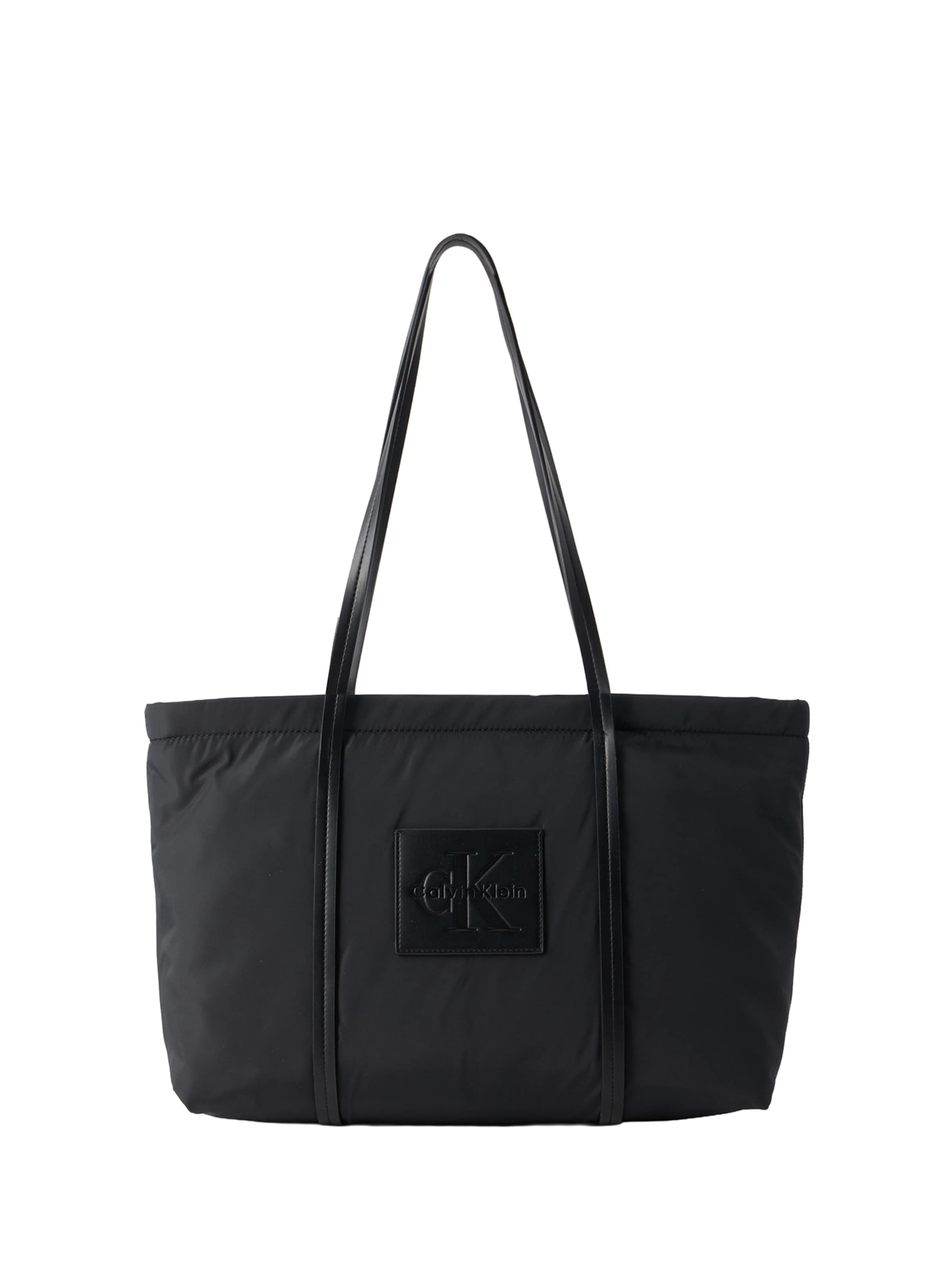 Plase de cumpărături de la Calvin Klein pe negru: față