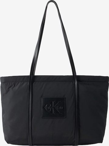 Plase de cumpărături de la Calvin Klein pe negru: față