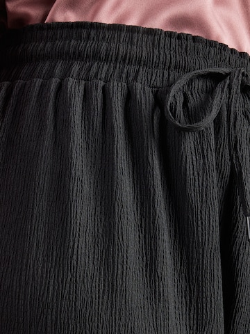 ONLY Carmakoma Zvonové kalhoty Kalhoty 'CARALTA' – černá