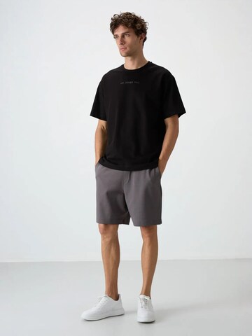 Tommy Life T-Shirts in Schwarz