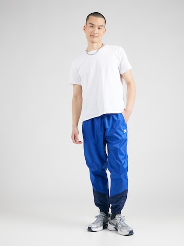 Effilé Pantalon 'Windrunner' Nike Sportswear en bleu