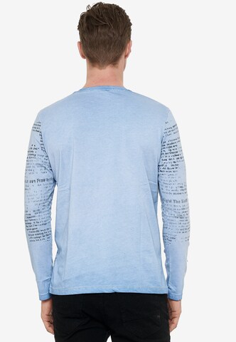 Rusty Neal Longsleeve mit coolem Front-Print in Blau