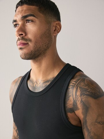 Next Aluspaita värissä musta