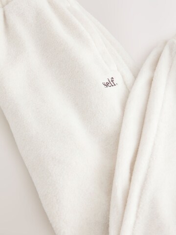 self. Tapered Pants in Beige