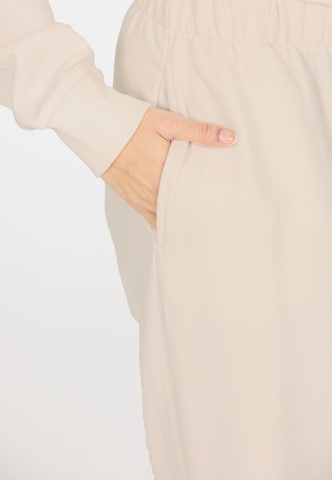 Athlecia Regular Sports trousers in Beige