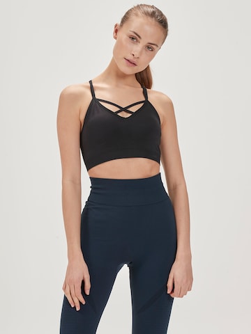 AthleciaBustier Sportski grudnjak 'Tulip' - crna boja: prednji dio