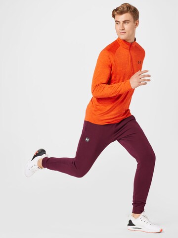 UNDER ARMOUR Tapered Sporthose 'Rival' in Rot