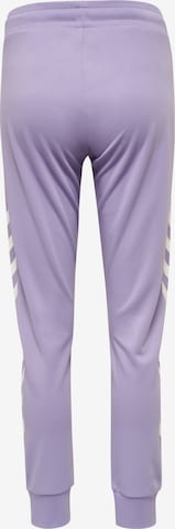 Effilé Pantalon de sport 'Legacy' Hummel en violet