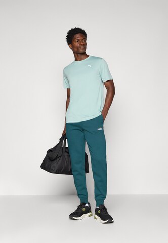 Maglia funzionale 'TAD ESSENTIALS' di PUMA in verde