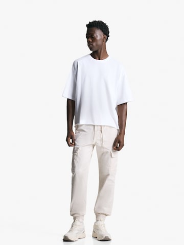Bershka Tapered Cargo nadrágok - sárga