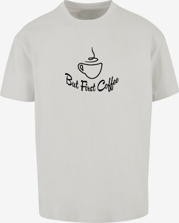 Merchcode Shirt 'But First Coffee' in Grijs: voorkant