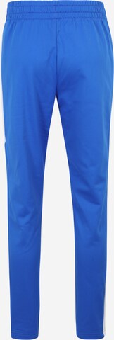 UNDER ARMOUR Ozke Športne hlače | modra barva