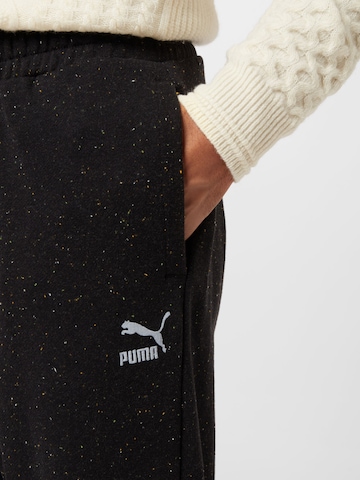 PUMA - Tapered Pantalón en negro