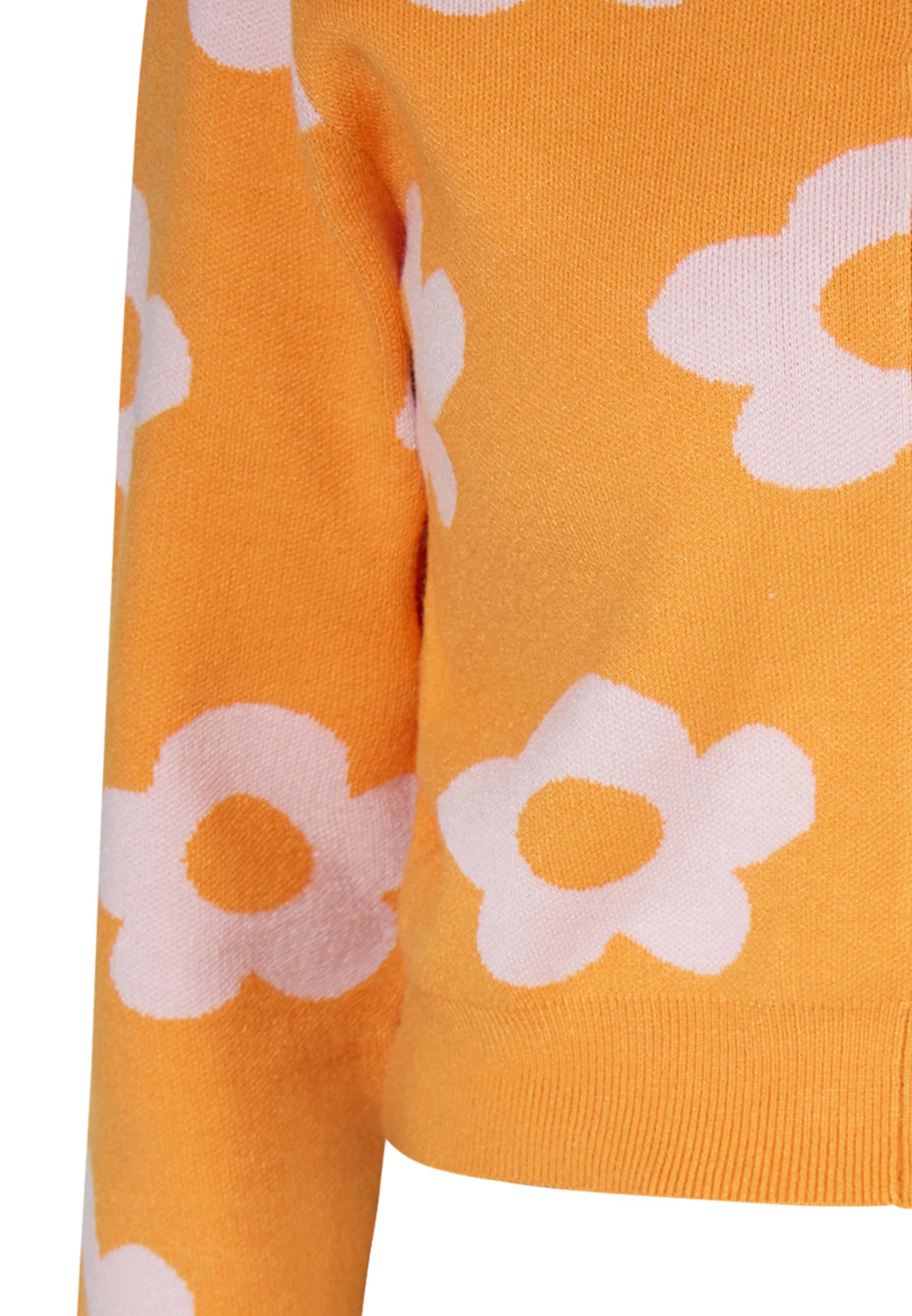 swirly Neuletakki värissä oranssi