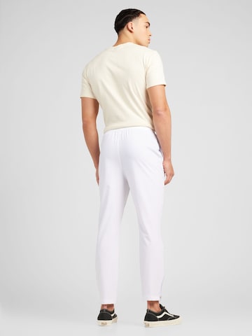 ELLESSE - Slimfit Calças de desporto 'Finn' em branco