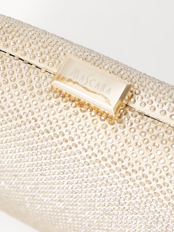 Pochette mascara en or