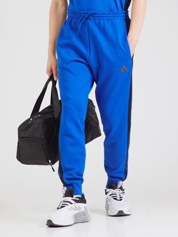 Tapered Pantaloni sportivi di ADIDAS SPORTSWEAR in blu: frontale