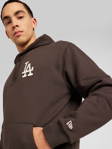 NEW ERA Sweatshirt 'League Essentials' in Braun