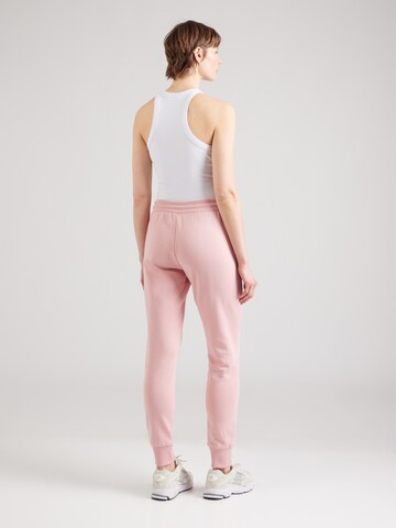 Tapered Pantaloni di Versace Jeans Couture in rosa