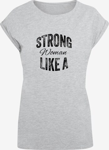 Merchcode T-Shirt 'WD - Strong Like A Woman' in Grau: predná strana