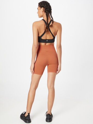 Skinny Pantaloni 'SAHANA' de la The Jogg Concept pe portocaliu