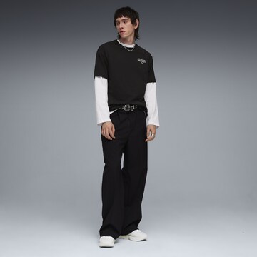 PUMA Shirt 'Slogan' in Zwart