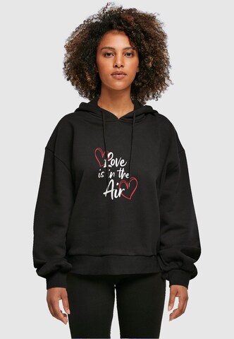 Merchcode Sweatshirt 'Valentines Day - Love is in the Air' in Zwart: voorkant
