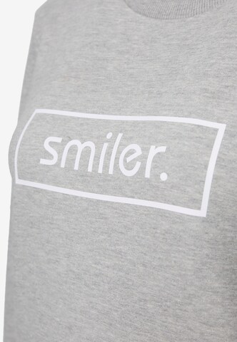 Sweat-shirt smiler. en gris