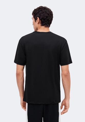 Mitchell & Ness T-shirt 'NBA PLAYER RAPTORS - CARTER' i svart: baksida