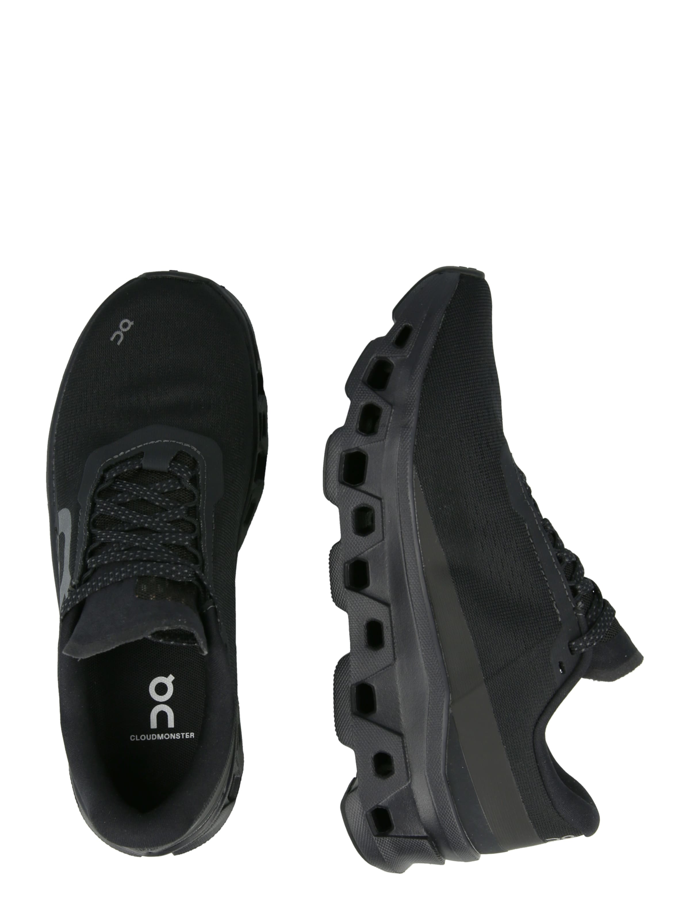 On Juoksukengät 'Cloudmonster 1' värissä musta