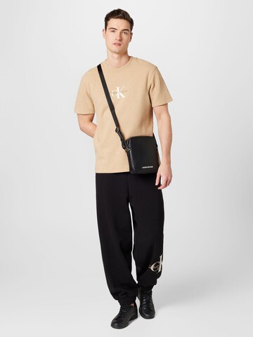 Maglietta di Calvin Klein Jeans in marrone