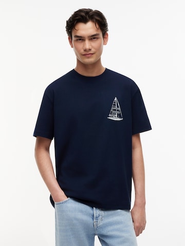 Tommy Jeans T-shirt 'SAILBOAT' i blå