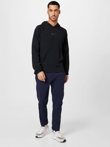 NIKE Urheilullinen collegepaita värissä musta