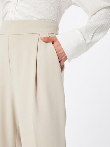 IMPERIAL Tapered Pleat-Front Pants in Beige