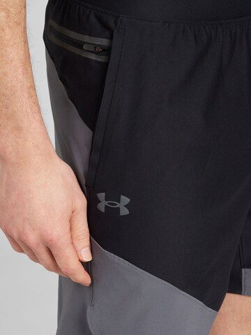 UNDER ARMOUR Regular Sportbroek 'Peak Woven Hybrid' in Zwart