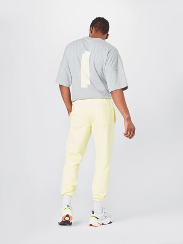 ABOUT YOU x Mero Loose fit Trousers 'Code' in Yellow