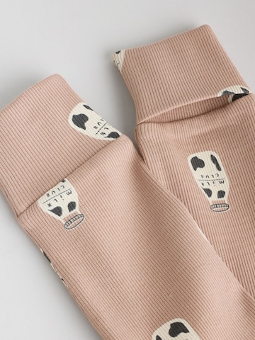 Tutina / body per bambino di Next in beige