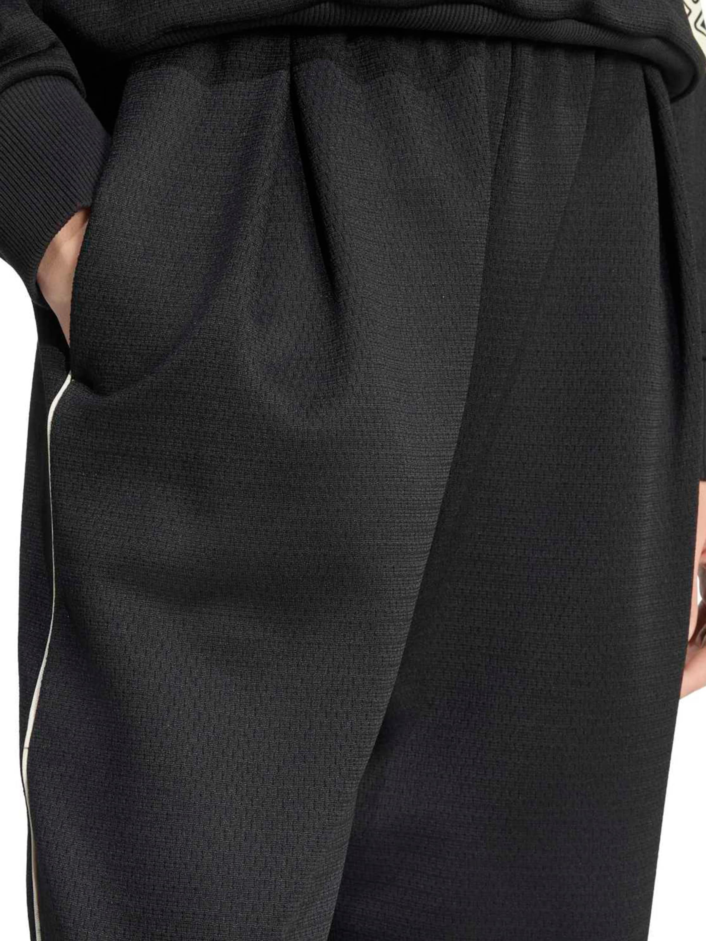 Wide leg Pantaloni sportivi di ADIDAS SPORTSWEAR in nero